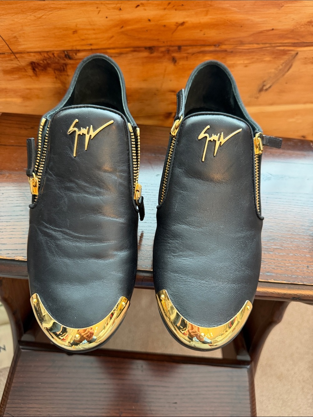 Giuseppe black leather side zippers w/gold accents